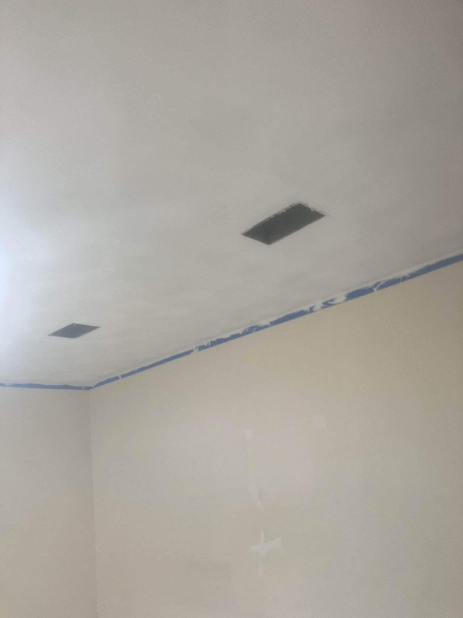 Interior walls after finish work, the point where paint takes over.