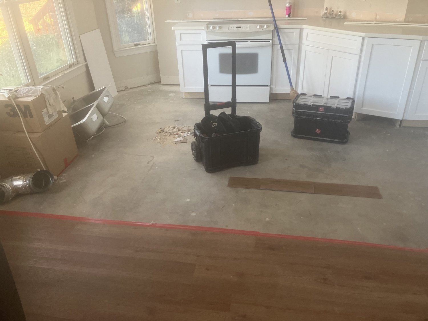 Flooring laid through an adjacent room.