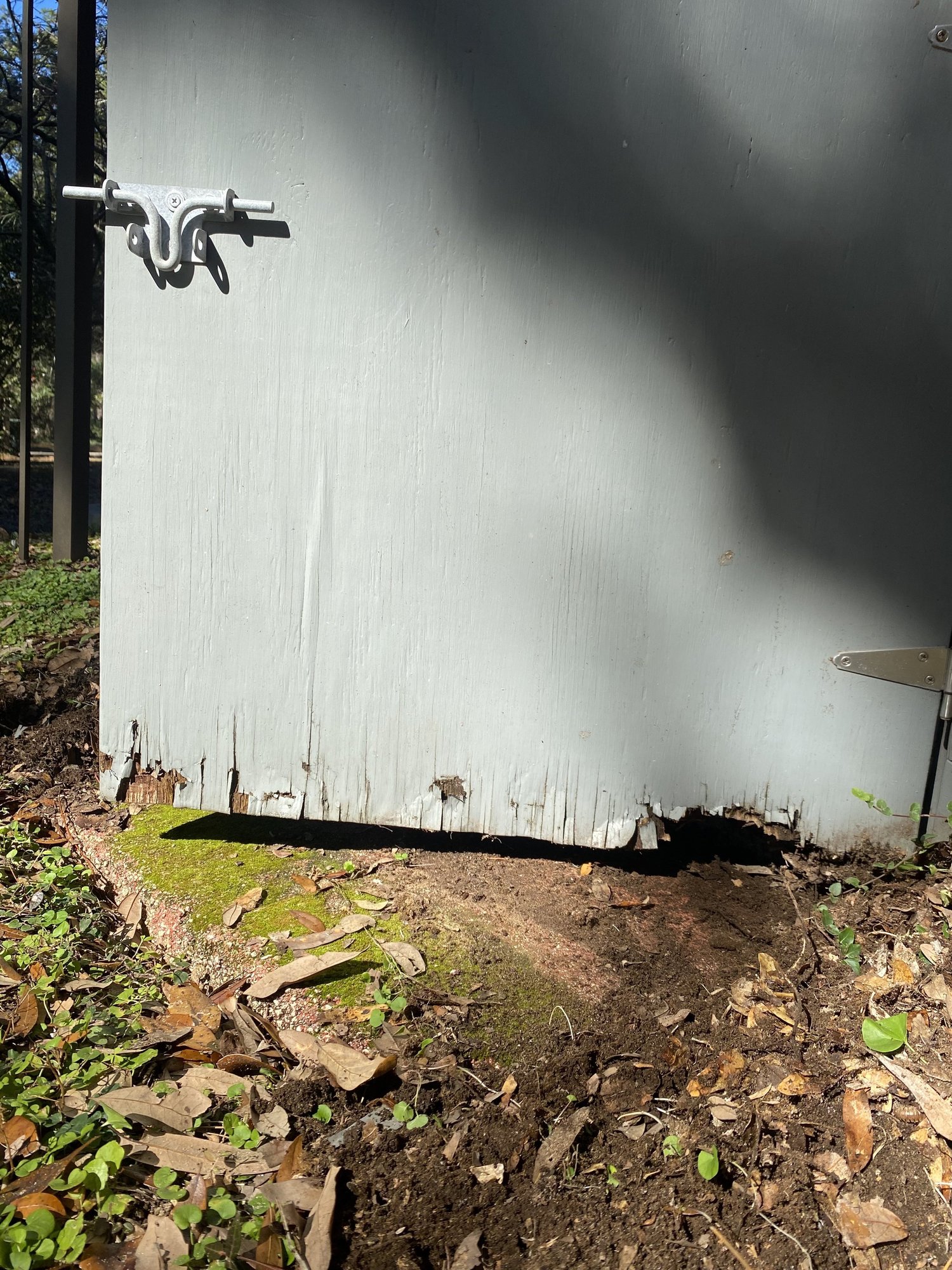Wood rot at the bottom of an exterior door, the kind of repair BT Coastal takes on decks, trim, and sills.